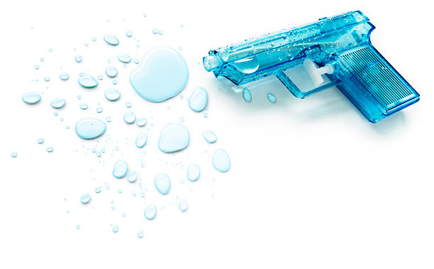 istock Blue squirt gun next to blue drops of water 184329684