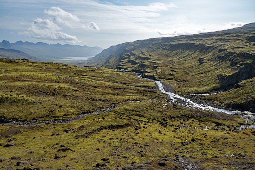 Berufjardara river valley and Fossarfell mountain from Route 939 in eastern Iceland on sunny autumn morning.