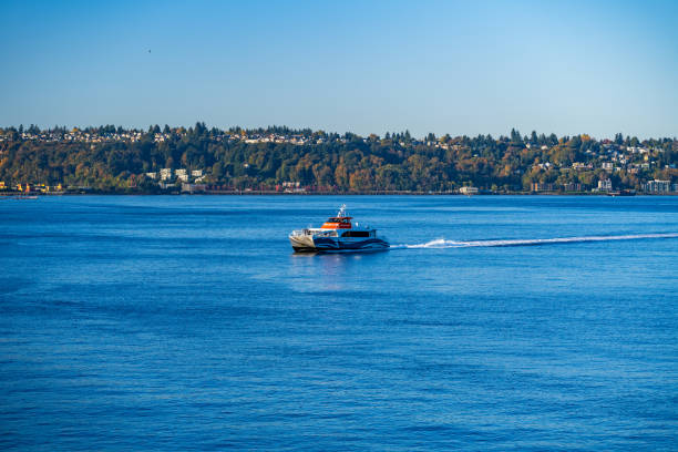 Kitsap County Fast Ferry Seattle WA, USA - October 27, 2023: A Kitsap County  Fast Ferry arriving at Pier 50. watertaxi stock pictures, royalty-free photos & images