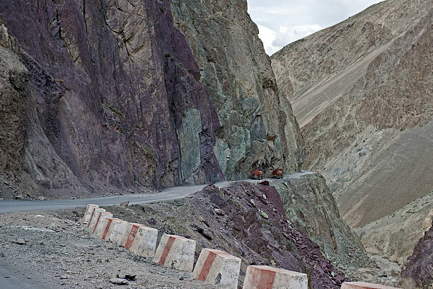 istock Trucks on Dangerous Road Likir Leh India 184329890