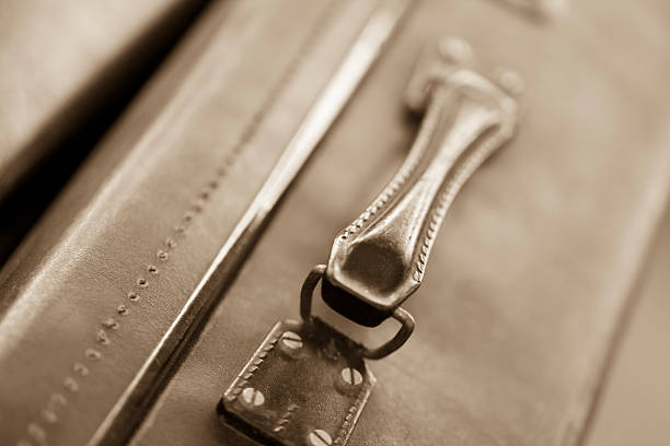 Two old suitcases on top of each other. Close up.