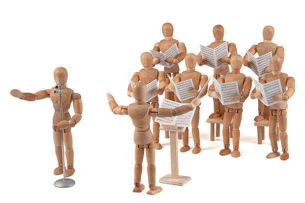 istock wooden mannequin chorus with singer 184330040