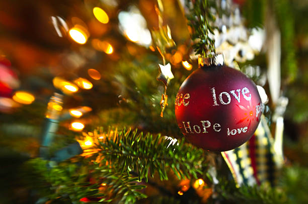istock Peace, love, Hope Ornament on a Christmas tree. 184330121