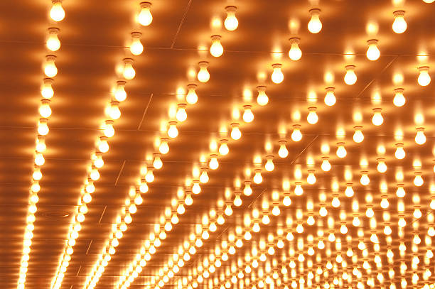 istock Rows of Brightly lit Theater Marquee Lights 184330206