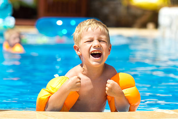 istock Little Boy Having Fun In The Pool 184330657