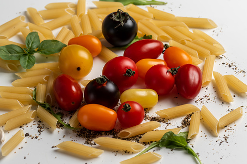 Penne, tomatoes, olives and spices as selection of Mediterranean healthy food