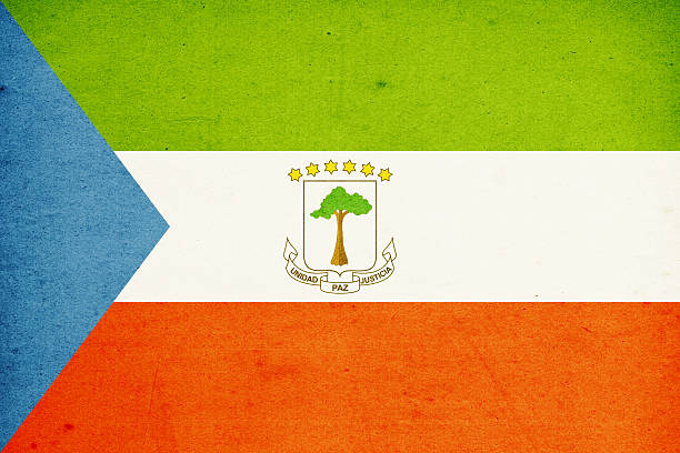 Close-up on a paper flag of Equatorial Guinea with light effect and vignette. Visible paper texture for super realistic effect. Selective focus. Canon 5D Mark II and Sigma lens.SEE MORE STATE FLAGS BELOW: