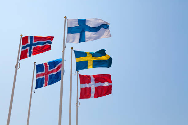Five flags of Nordic Countries blowing in the wind stock photo