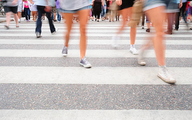 istock Motion blurred pedestrians on zebra crossing 184331239