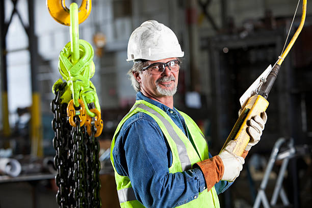 istock Worker in factory with industrial hook and chains 184331889
