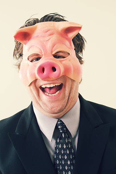 ビジネスの男性の豚のお面 - pig greed business mask ストックフォトと画像