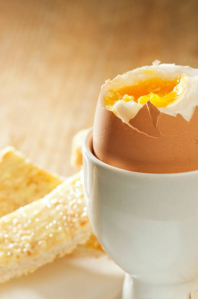 istock Boiled egg in eggcup with buttered toast soldiers 184332627