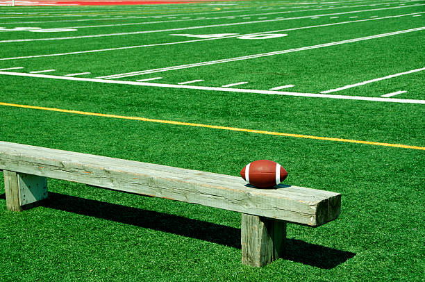 Football on bench stock photo