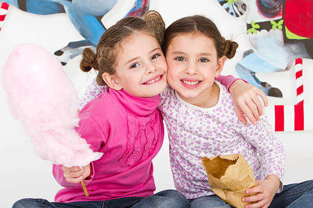istock Happy friends having fun at amusement park - studio shot 184333095