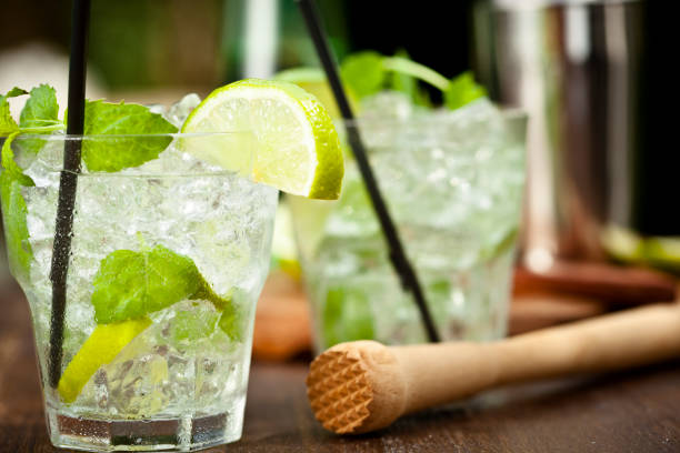 Mojito with White Rum, Lime, Mint and Crushed Ice "Mojito with white rum, lime, mint and crushed ice" mojito stock pictures, royalty-free photos & images