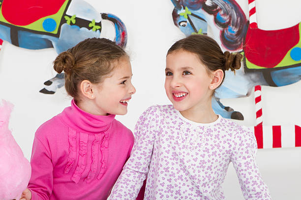 istock Happy friends having fun at amusement park - studio shot 184333784