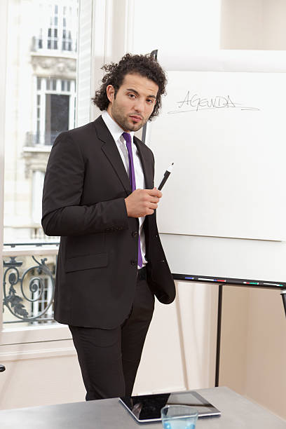 istock Young professional setting meeting agenda 184333869