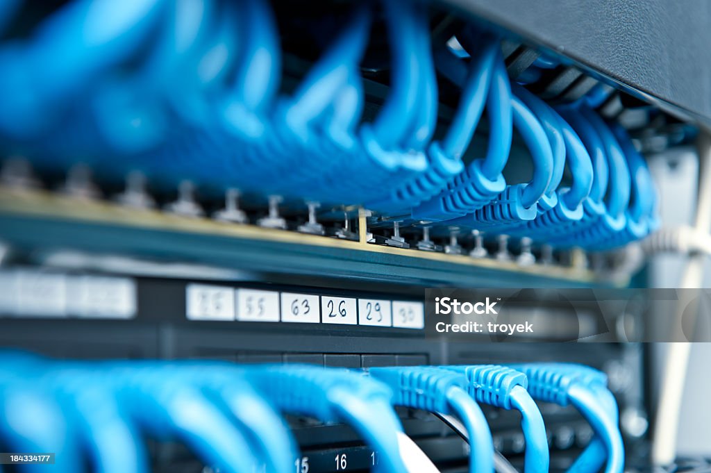 Network hub and cable Network panel, hub and cable Blue Stock Photo