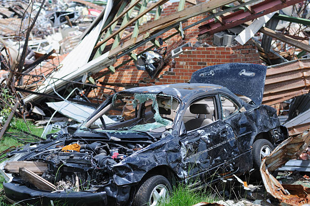istock Car destroyed by tonado among debris 184334459