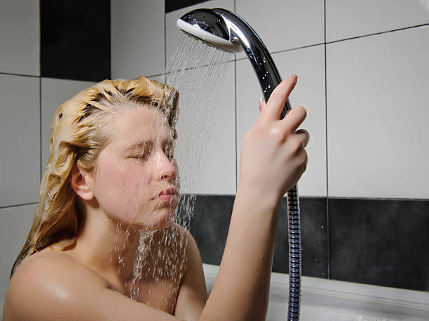 woman shower nice blonde woman at shower. shower women falling water human face stock pictures, royalty-free photos & images