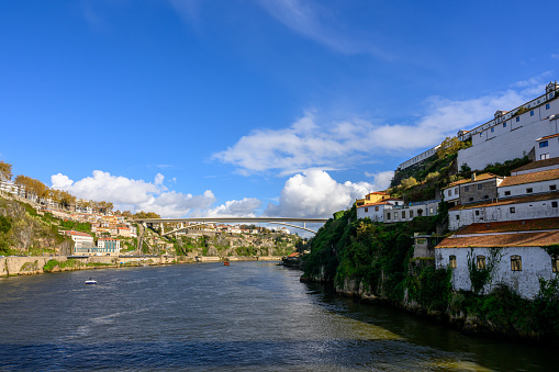 The bridge has a slim modern profile with good view of the city Porto.