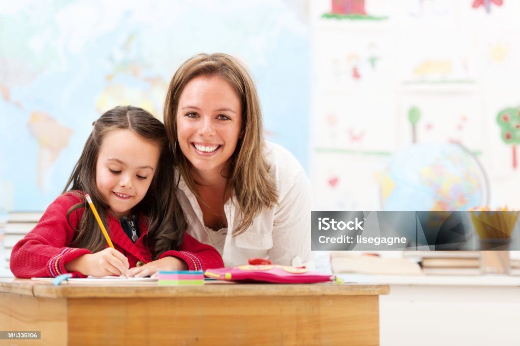Schoolgirl and teacher 30-39 Years Stock Photo