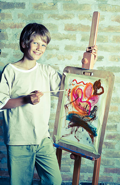 istock Smiling boy with his painting. 184335597
