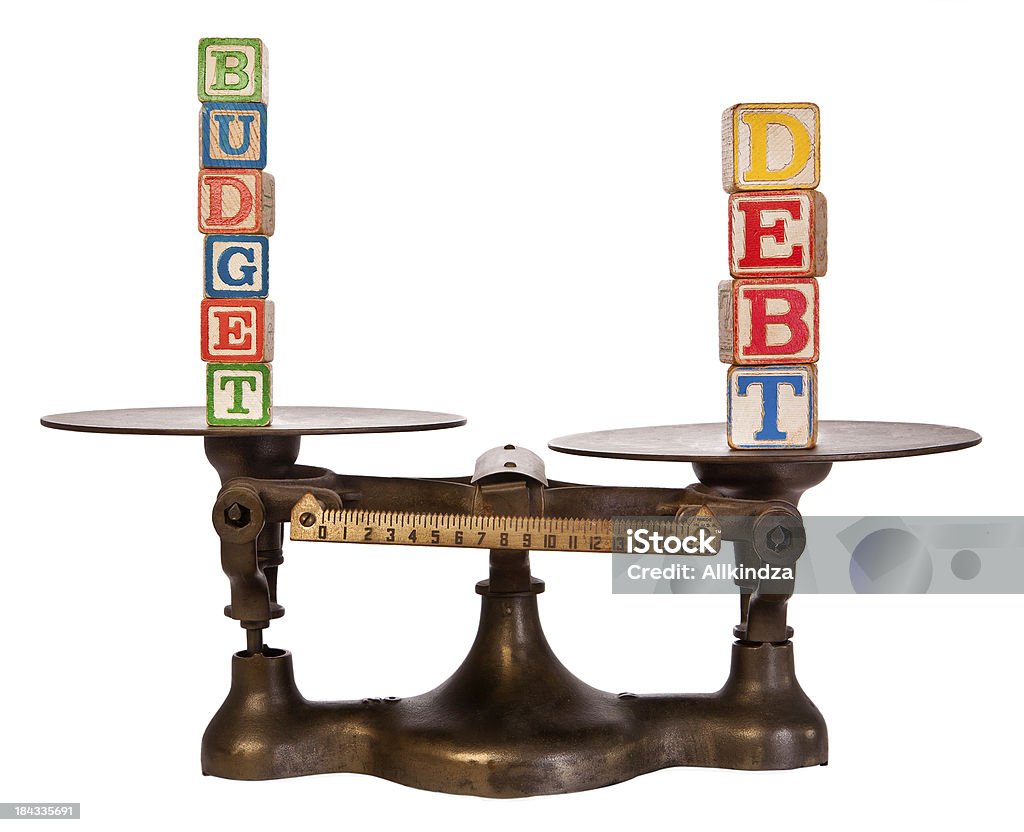 Schulden Outweighs budget auf antike Waage - Lizenzfrei Schulden Stock-Foto