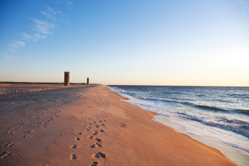 Early morning (sunrise) scene of WWII observation towers on beach near Gordon's Pone in Rehoboth Beach, Delaware.
