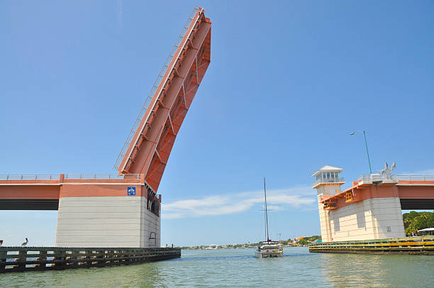 Draw Bridge Draw Bridge with sailboat going under it. opening bridge stock pictures, royalty-free photos & images