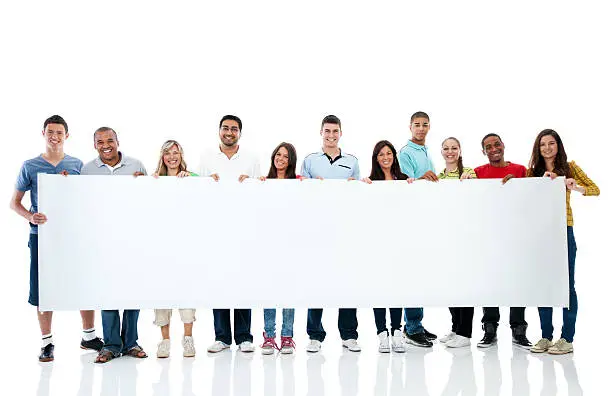 Photo of Large group holding a big white board.