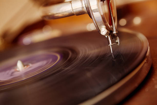 Old gramophone Old gramophone playing a record. record player needle stock pictures, royalty-free photos & images