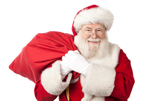 Santa Claus with magic staff and sack of Christmas gifts.