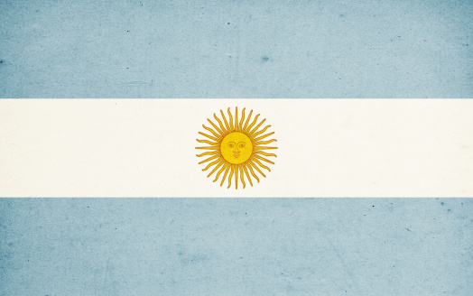 Close-up on a paper flag of Argentina with light effect and vignette. Visible paper texture for super realistic effect. Selective focus. Canon 5D Mark II and Sigma lens.