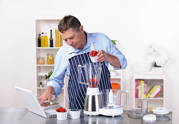 istock Healthy Mature Man Using An Online Recipe 184336798