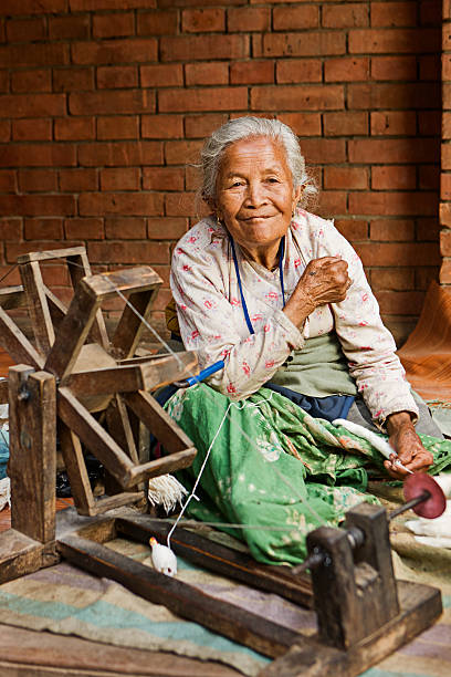 istock Nepali woman spinning the wool. Bhaktapur 184336823