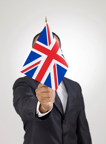 Businessman holding British flag