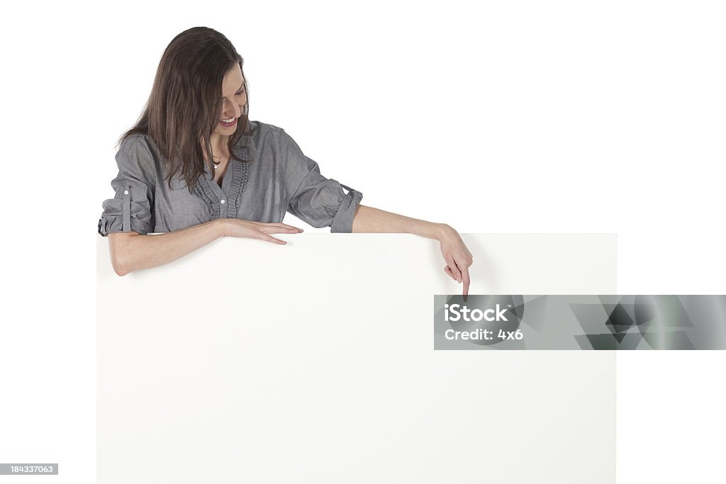 Woman holding a whiteboard Woman holding a whiteboardhttp://www.twodozendesign.info/i/1.png 20-29 Years Stock Photo