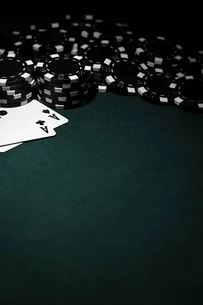 Photo of Pocket Aces with Black Poker Chips