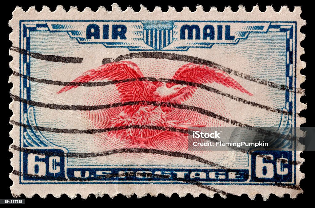 Canceled Airmail Postage Stamp. Isolated on Black. Old canceled United States Air Mail Postage Stamp. Large file with a lot of detail.  1930-1939 Stock Photo