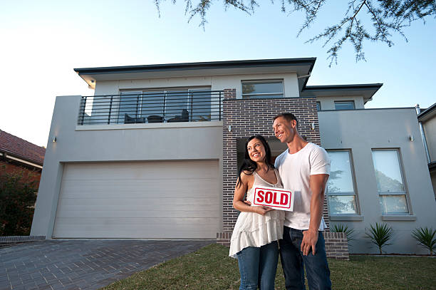 istock Couple standing in front of a modern house 184337487