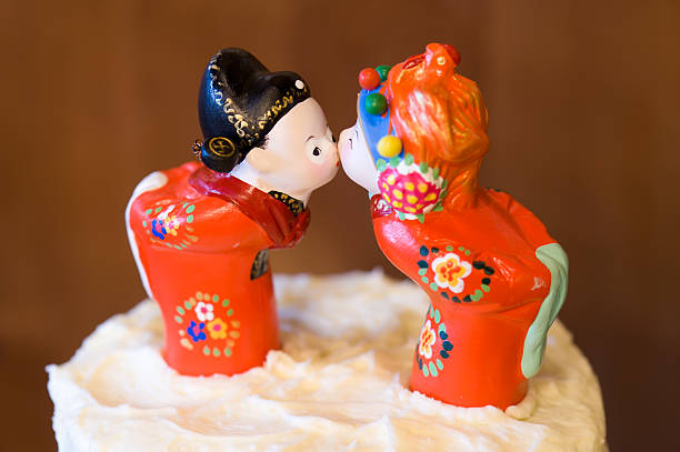 Asian Figurines on top of Wedding Cake.  Cake decorations.  Captured as a 14-bit Raw file. Edited in ProPhoto RGB color space.