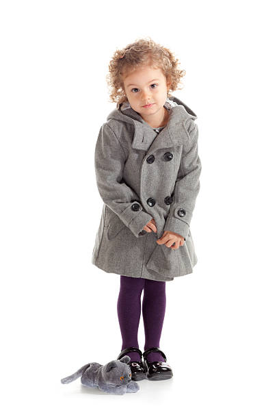 istock little girl in coat 184337880