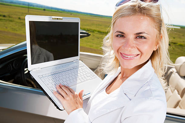 istock Beautiful woman using her laptop in the nature. 184337960