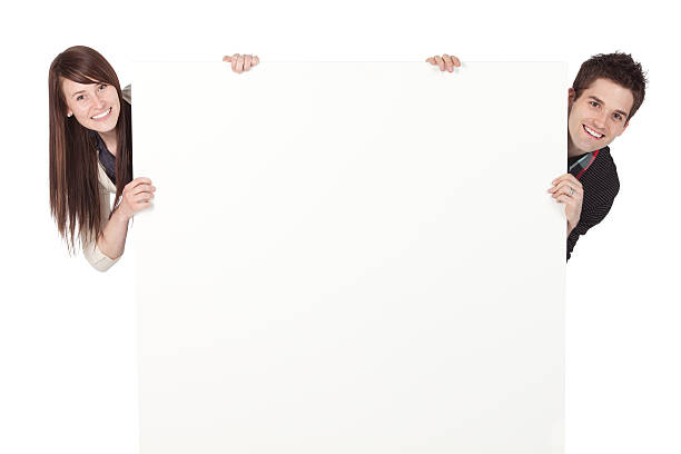 istock Couple peeking from behind a placard 184338066