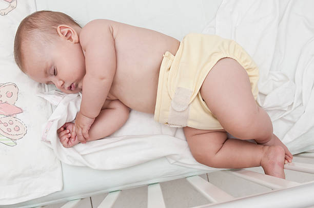 istock Cute Baby Girl sleeping in her Bed 184338429