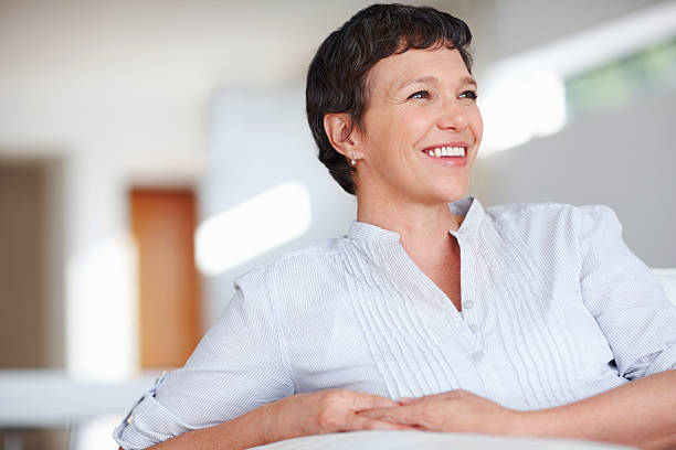 istock Mature woman on sofa 184338531