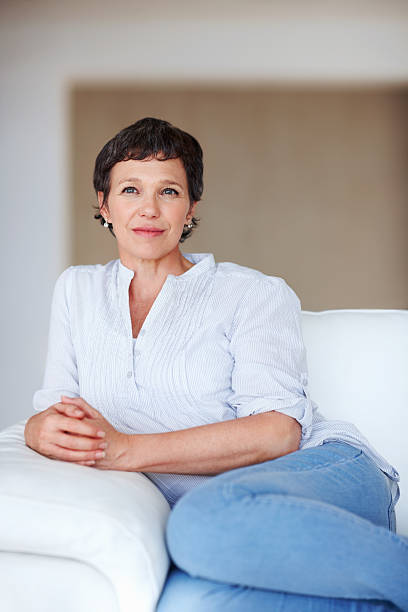 istock Pensive, mature woman at home 184338542