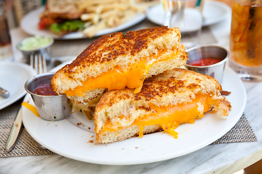 Grilled cheese sandwich at restaurant. (SEE LIGHTBOXES BELOW for more lunch, dinner, meals & food backgrounds...)