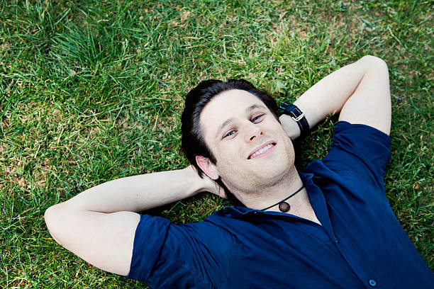 istock Happy Young Man in the Grass 184338925